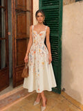 Vestido midi con tirantes estilo bustier y estampado floral de aves