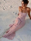 Vestido largo veraniego fluido de tirantes con estampado floral y diseño cruzado